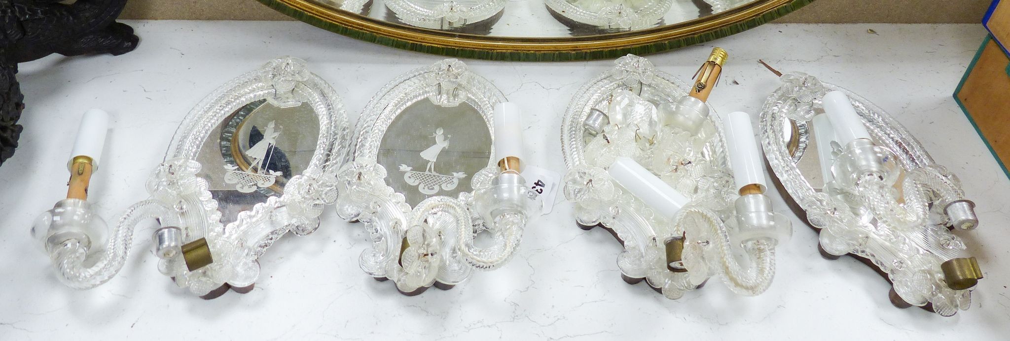 A set of four Venetian glass mirrored girandole mirrors, 25cm
